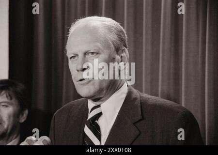 Vintage photo of president Gerald Ford speaking into microphones. USA, 1974 Aug. 9. Stock Photo