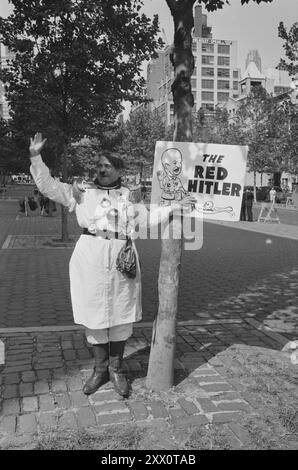 Vintage photo of man dressed as Adolf Hitler with sign reading 'The Red Hitler,' protesting the visit of Soviet Premier Nikita Khrushchev, near the United Nations building, New York City. USA. 09/21/60 (21 September 1960) By Marion Trikosko. Stock Photo