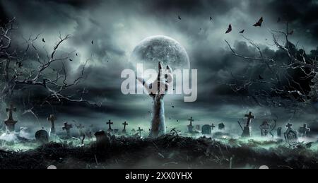 Zombie Hand Rising Out Of A GraveYard - Halloween Stock Photo