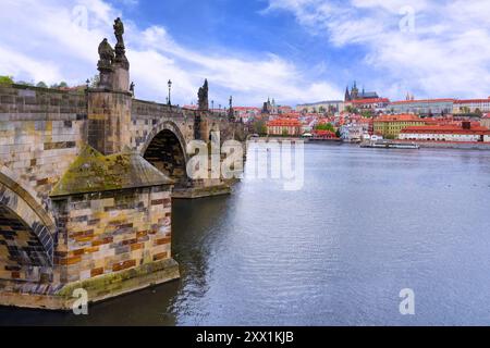 Charles Bridge, Old Town Bridge Tower, Medieval stone arched bridge over the Vltava River and the Castle with the Cathedral, Prague, Czech Republic Stock Photo