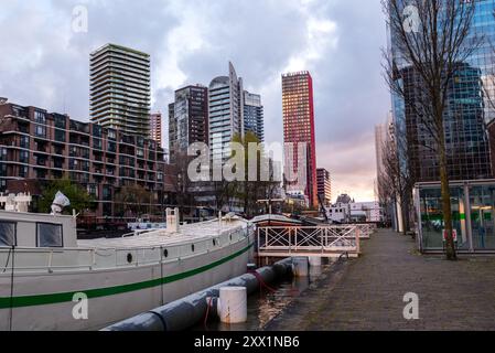 Red Apple and Terraced Tower of Rotterdam in Harbor Gracht of Blaak Rotterdam Wijnhaven, Rotterdam, The Netherlands, Europe Stock Photo