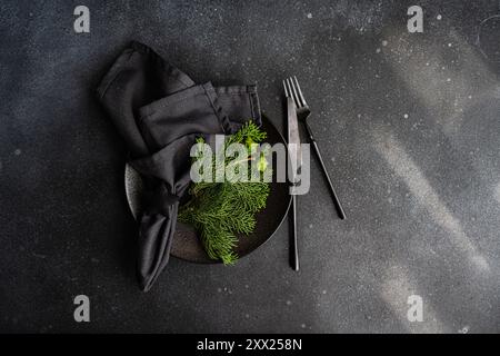 Overhead view of a Christmas place setting with fresh thujia branches Stock Photo