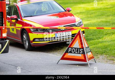 Two cars were burnt out after a fire on Wednesday morning in Hudiksvall, Sweden. Emergency services and police on site Stock Photo