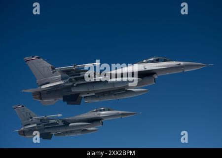 August 9, 2024 - Joint Base McGuire-Dix-Lakehurst, New Jersey, USA - U.S. Air Force F-16 Fighting Falcons assigned to the 706th Aggressor Squadron participate in exercise Bamboo Eagle 24-3 with 32nd Air Refueling Squadron air crews over the Pacific Ocean, August. 9, 2024. As part of the 305th Air Mobility Wing, the 32nd ARS operates the KC-46 Pegasus aircraft conducting air refueling missions necessary to support air mobility missions on a global scale. During BE 24-3, Air Mobility Command assets supported warfighters implementing all-domain combat-power generation from disaggregated basing lo Stock Photo