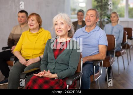 Group of mature students attending lecture in college Stock Photo