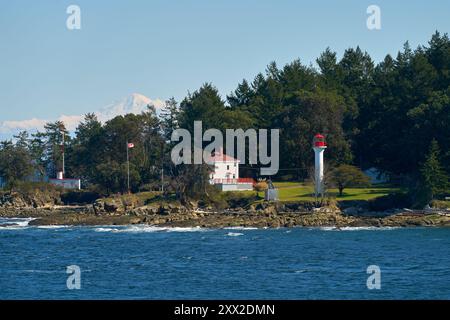 Historic Georgina Point Lighthouse Mayne Island BC. Georgina Point Lighthouse on the shore of Mayne Island, BC, Canada. Stock Photo