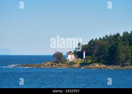 Georgina Point Lighthouse Mayne Island Salish Sea. Georgina Point Lighthouse on the shore of Mayne Island, BC, Canada. Stock Photo