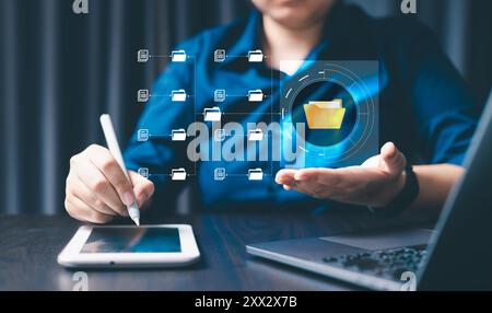 Corporate enterprises manage their information efficiently by organizing online documents and files into a secure cyberspace database and folder manag Stock Photo