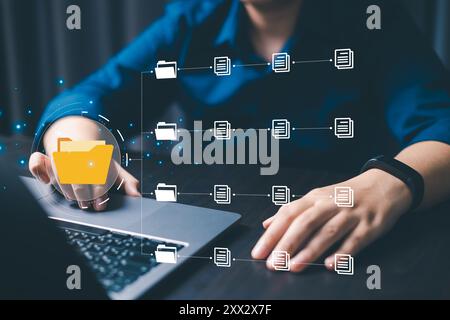 Corporate enterprises manage their information efficiently by organizing online documents and files into a secure cyberspace database and folder manag Stock Photo