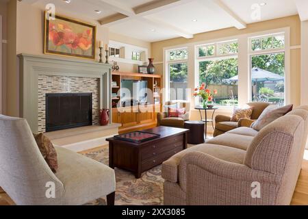 Living room in tones of yellow and beige with nice view to backyard Stock Photo