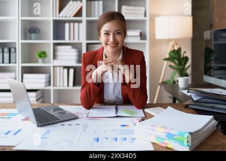 woman happiness plans for financial success by integrating budget and marketing strategies to optimize overall finance management. Stock Photo