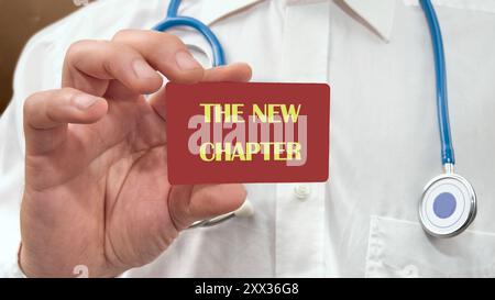 The new chapter words written on ripped pink paper with yellow ...