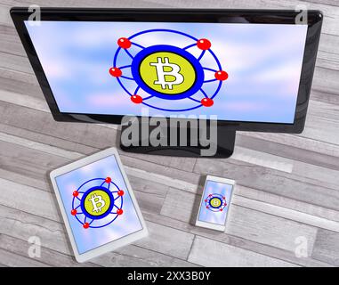 Bitcoin concept shown on different information technology devices Stock Photo