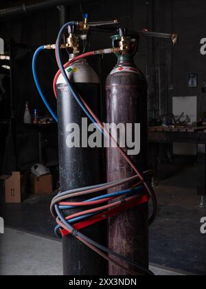 Gas bottles for welding in a factory in England. Stock Photo