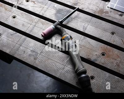 A welder at work in a workshop in Newcastle Upon Tyne in England, United Kingdom. Stock Photo