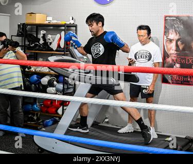 Daigo Higa , left, of Japan fight with Seiya Tsutsumi , right, of Japan ...