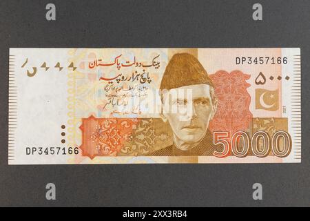 Pakistani 5000 Rupees Brown Color Banknote Front Feathering Muhammad Ali Jinnah Portrait Stock Photo