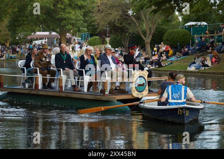 A procession of decorated boats and barges form a floating parade along the Royal Military Canal in Hythe Kent, UK, 21st August 2024. Stock Photo