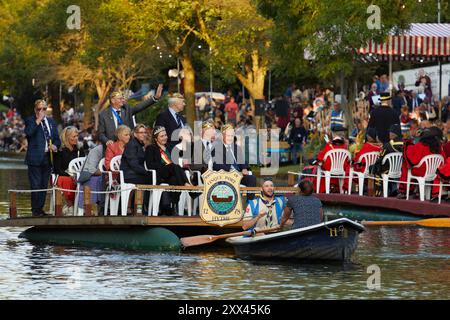 The Hop Queen of Poperinge rides on a float with other representatives from Hythe's twin town of Poperinge at the Hythe Venetian Fete. Decorated floats parade along the Royal Military Canal in Hythe Kent, UK, 21st August 2024. Stock Photo