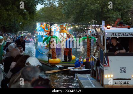 A procession of decorated boats and barges form a floating parade along the Royal Military Canal in Hythe Kent, UK, 21st August 2024. Stock Photo