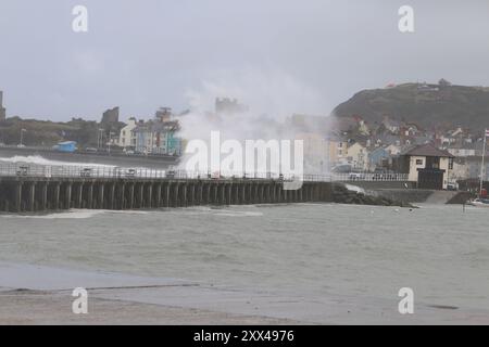 Aberystwyth Wales UK weather August 22nd 2024 . The tail end of hurricane ERNESTO hits the west Wales coast, fierce wind drives in huge waves blasting sea defences putting people and property at risk, Credit: mike davies/Alamy Live News Stock Photo