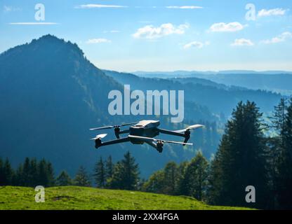 flying drone in the Allgaeu mountains taking pictures and movies Stock Photo