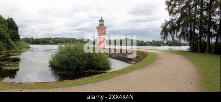 Lake harbor with Lighthouse on the jetty, near Little Pheasant Castle, view on a cloudy day from the park, Moritzburg, near Dresden, Saxony, Germany Stock Photo