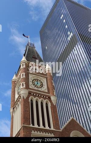 Historic architecture of the tower of Perth town hall in front of a modern skyscraper, Western Australia Stock Photo