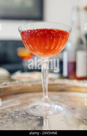 pink sparkling rose in champagne coupe on silver tray Stock Photo