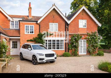 Large executive mansion house and luxury car in a rural setting, Buckinghamshire, England, UK Stock Photo