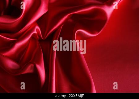 Ripples in red silk fabric Stock Photo