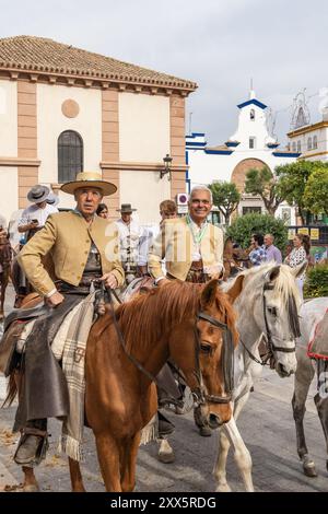 Andujar, Jaen Province, Andalusia, Spain. April 29, 2023. Men in traditional dress riding horses for a procession during a relgious fesitval in Anduja Stock Photo