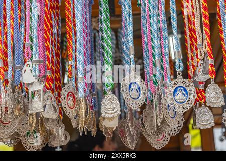 Virgen de la Cabeza, Andujar, Jaen Province, Andalusia, Spain. April 30, 2023. Religious medallions for sale at the annual pilgrimage for the Virgen d Stock Photo