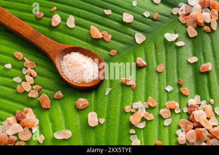 Pure salt in fine grained and coarse grains - Himalayan pink crystals. Stock Photo