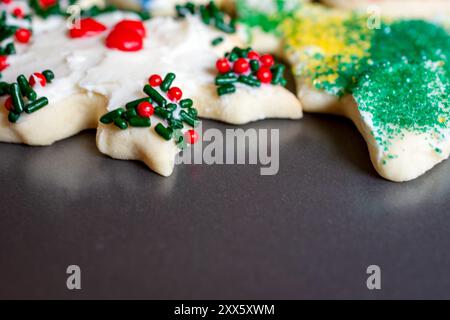 Frosted and decorated sugar cookies are on a baking sheet to dry. Stock Photo