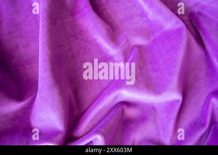 Lilac knitted texture fabric. Purple textile cloth background. Soft material for fashion clothes. Stock Photo