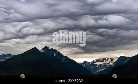 Ominous mammatus clouds over Mount Iliamna in the Chigmit Mountain Range - Chinitna Bay, near Lake Clark National Park and Preserve, Alaska Stock Photo
