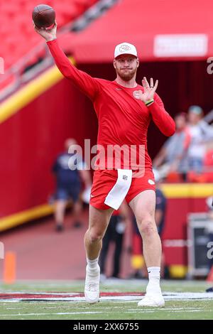 Kansas City Chiefs quarterback Carson Wentz (11) looks to hand off the ...