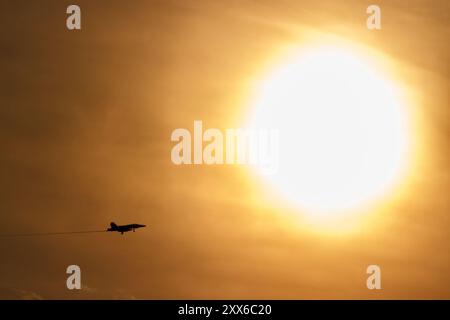 A McDonnell Douglas F/A-18C Hornet fighter jet with USMC All Weather Fighter Attack Squadron 224 (VMFA(AW)-224), known as the 'Bengals' at sunset Stock Photo