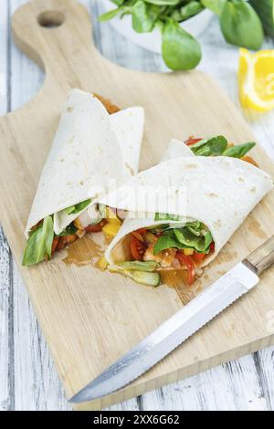 Chicken Wraps on a wooden table as detailed close-up shot (selective focus) Stock Photo