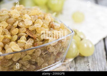 Heap of Raisins with fresh fruits (close-up shot) Stock Photo