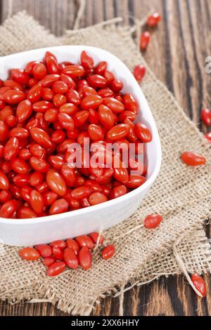 Some fresh Goji Berries (also known as Wolfberry) on vintage wooden background Stock Photo