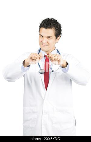 A hispanic male doctor in lab coat, stethoscope smiling while breaking a cigarette in half to encourage the healthy habit of quitting smoking. V Stock Photo