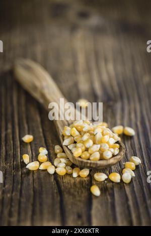 Dried Corn (detailed close-up shot, selective focus) on vintage wooden background Stock Photo