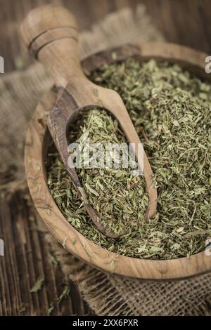 Old wooden table with dried Stevia leaves (close-up shot, selective focus) Stock Photo