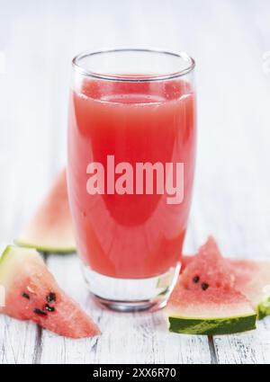 Homemade Watermelon Smoothie on an wooden table (selective focus) as detailed close-up shot Stock Photo