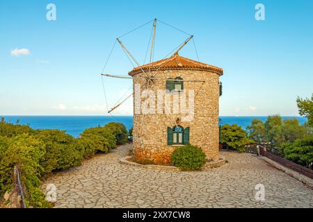 Old Windmill in Agios Nikolaos near blue caves in Zakynthos (Zante) island, in Greece. Stock Photo