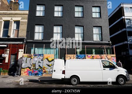 Boards are attached to a property as preparations continue ahead of this year's Notting Hill Carnival over the Summer Bank Holiday weekend in west London. Picture date: Friday August 23, 2024. Stock Photo