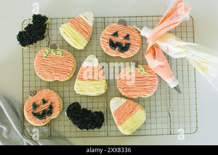 Decorated Halloween cookies in pumpkin, candy corn, and bat shap Stock Photo