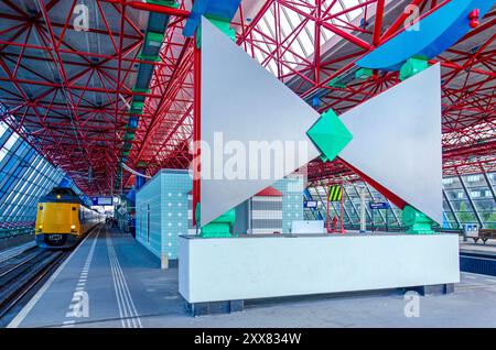 Lelystad, The Netherlands, August 4, 2024: the central railway station built in the 1980's is a mixture of hi tech architecture and postmodernism Stock Photo